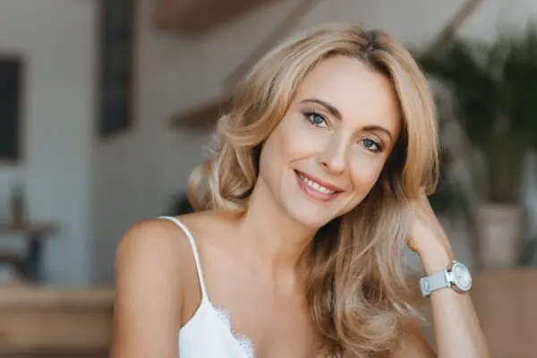 portrait of beautiful happy middle aged woman smiling at camera
